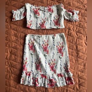Floral 2 piece skirt and crop top outfit.